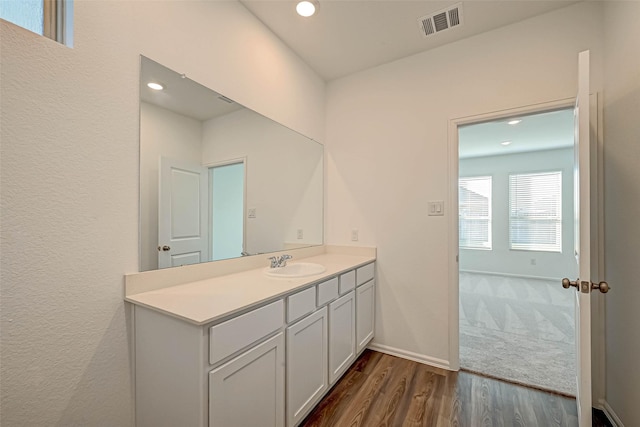 bathroom with vanity and wood-type flooring