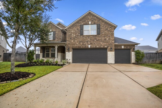 view of front property with a garage and a front yard