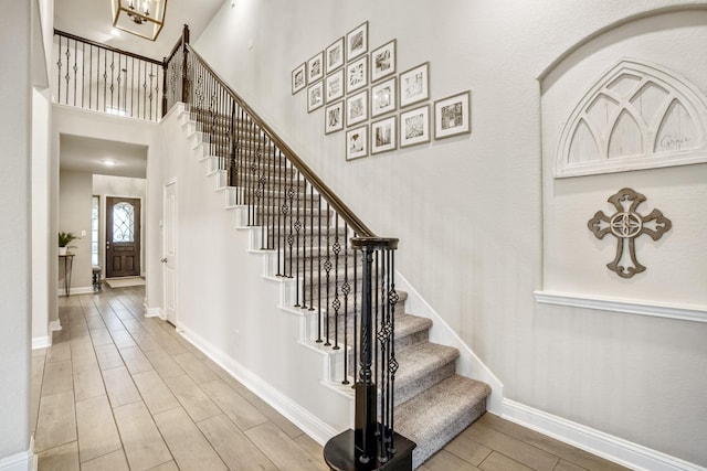 stairway with a towering ceiling