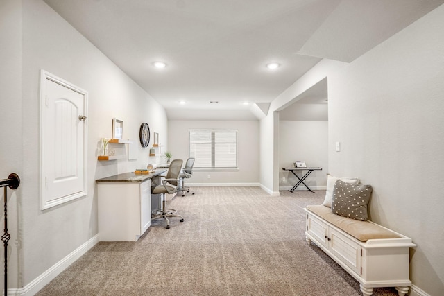 carpeted office with built in desk