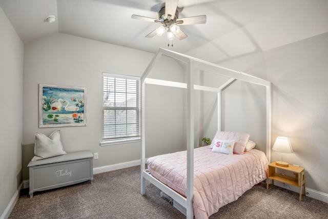 carpeted bedroom with ceiling fan and vaulted ceiling