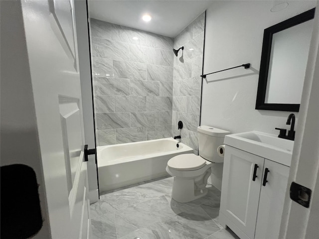 full bathroom with vanity, toilet, and tiled shower / bath combo