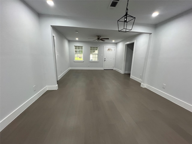 interior space featuring ceiling fan and dark hardwood / wood-style flooring