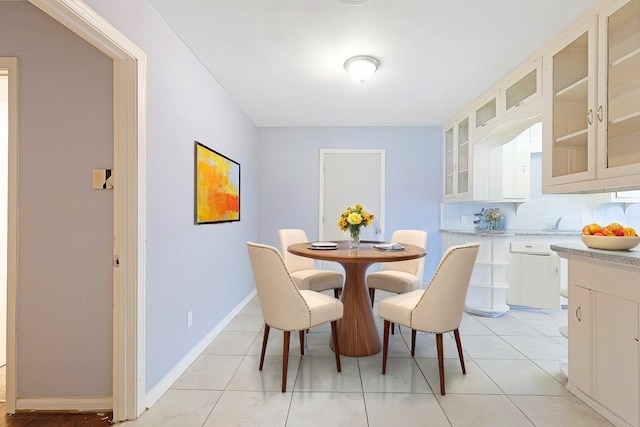 dining area with light tile patterned flooring