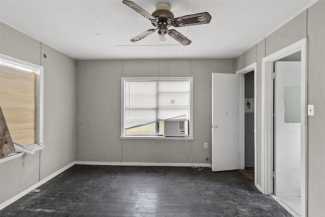 unfurnished room with dark hardwood / wood-style floors and ceiling fan