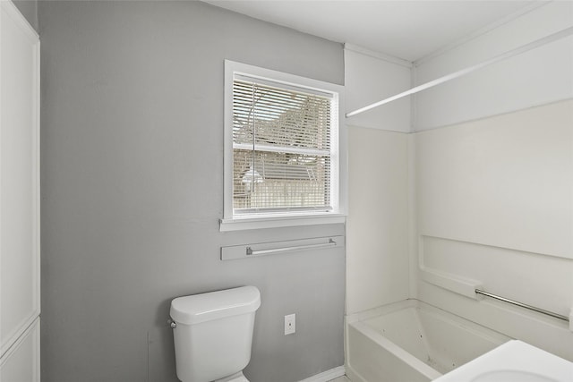 bathroom featuring toilet and shower / bath combination