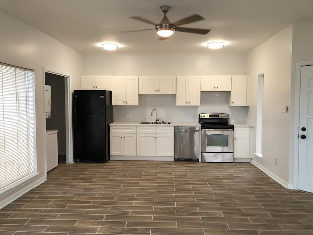 kitchen with white cabinetry, ceiling fan, stainless steel appliances, and sink