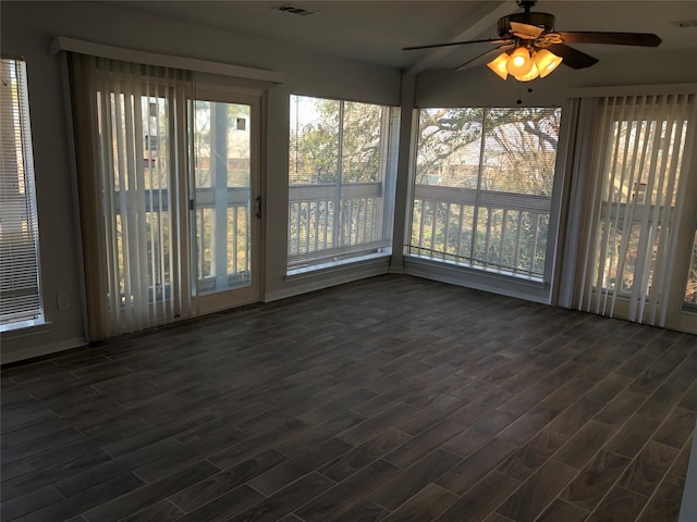 unfurnished sunroom with plenty of natural light and ceiling fan