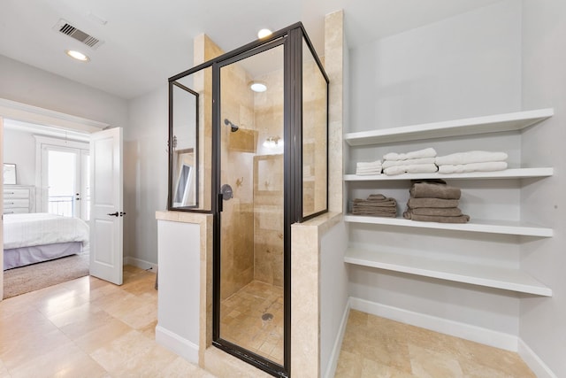 bathroom featuring a shower with shower door