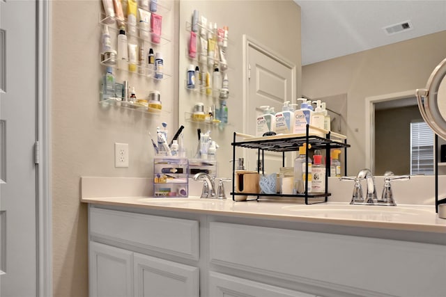 bar featuring sink and white cabinets