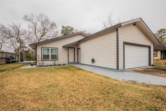 single story home with a garage and a front yard