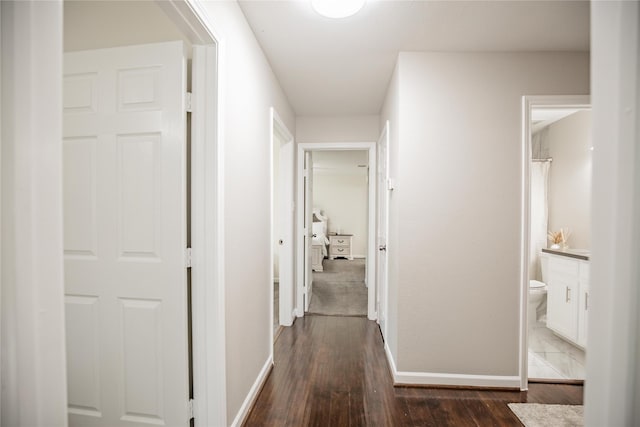 hall with dark wood-type flooring