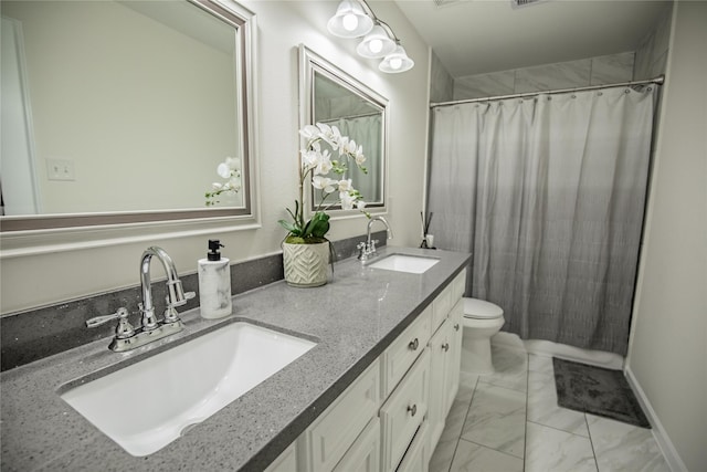 bathroom with vanity, toilet, and curtained shower