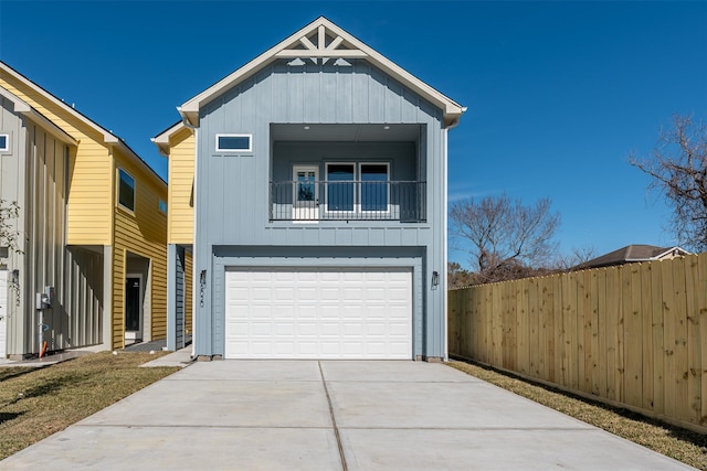 view of front of property with a garage and a balcony