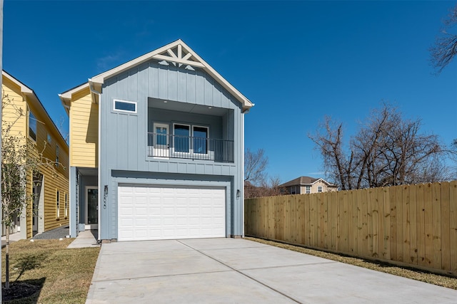 view of front facade featuring a garage and a balcony