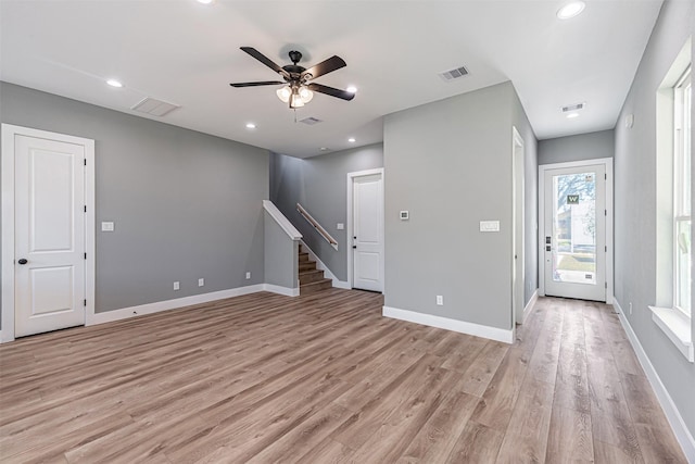 unfurnished living room with ceiling fan and light hardwood / wood-style floors