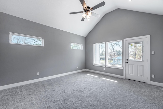 unfurnished living room with lofted ceiling, carpet floors, and ceiling fan