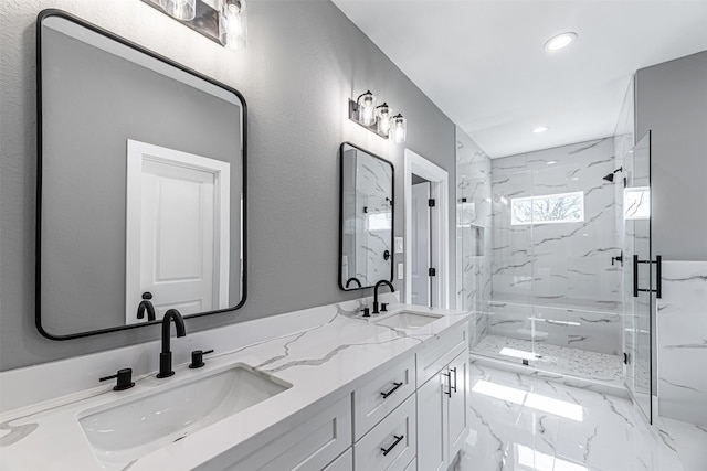 bathroom featuring vanity and a shower with shower door