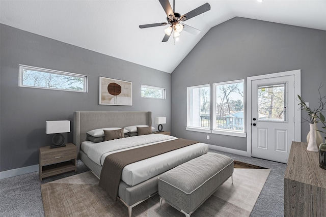 carpeted bedroom with ceiling fan and vaulted ceiling