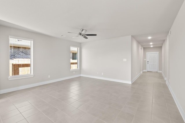 empty room featuring recessed lighting, baseboards, ceiling fan, and light tile patterned floors