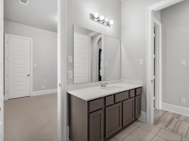 bathroom featuring tile patterned floors and vanity