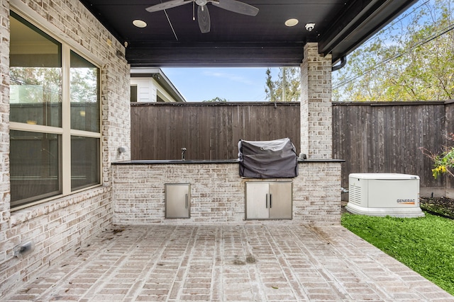 view of patio featuring exterior kitchen and ceiling fan