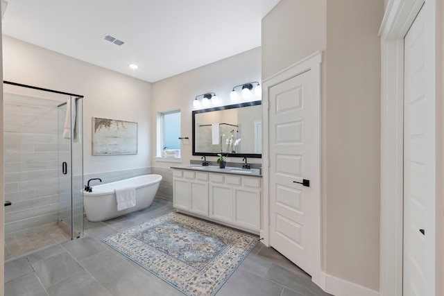 bathroom featuring vanity, tile patterned floors, and shower with separate bathtub