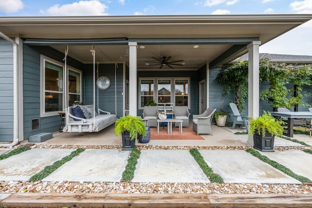 property entrance featuring ceiling fan and covered porch