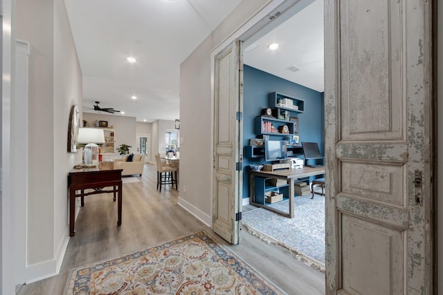 corridor featuring light hardwood / wood-style flooring