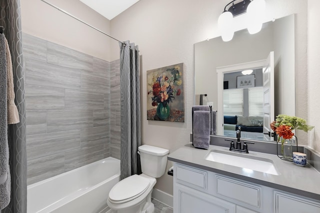 full bathroom with vanity, toilet, and shower / bath combo with shower curtain