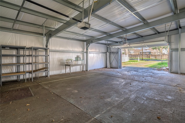 garage with metal wall and a garage door opener