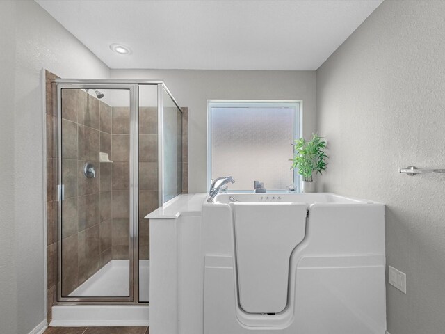 bathroom with an enclosed shower