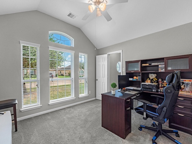 carpeted home office featuring ceiling fan and vaulted ceiling