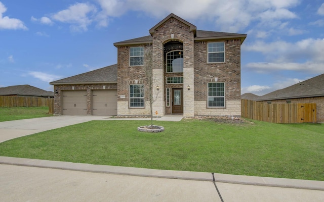 view of front of home featuring a garage and a front lawn