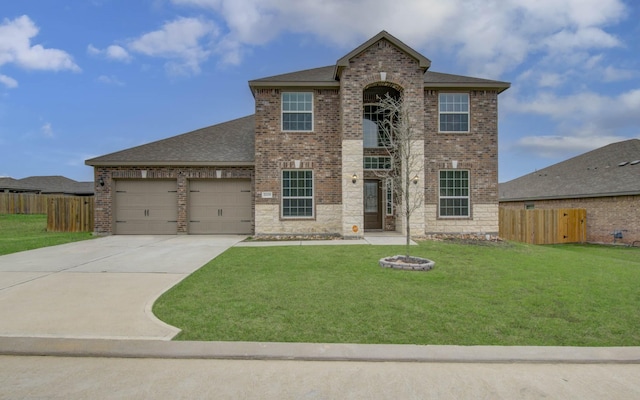 view of front of house with a garage and a front yard