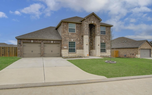 view of front facade with a garage and a front yard