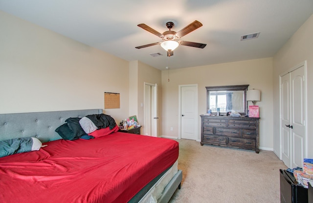 bedroom with light colored carpet and ceiling fan