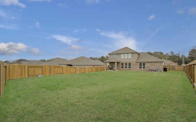 rear view of house featuring a lawn