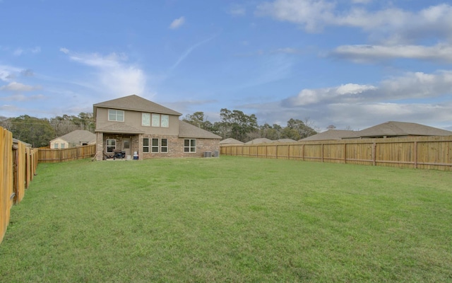 back of property featuring a yard