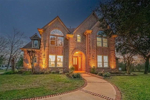 view of front of house with a lawn