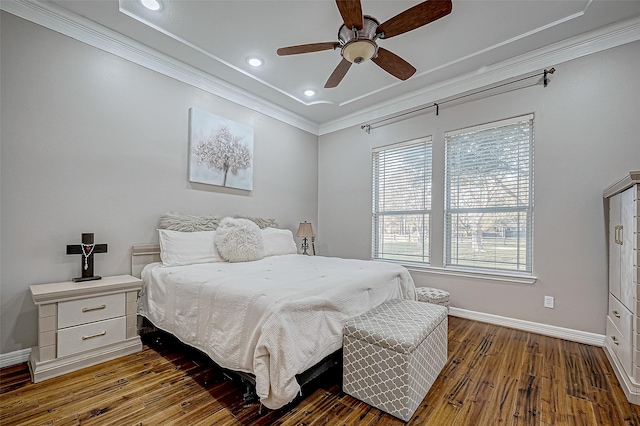 bedroom with hardwood / wood-style flooring, ceiling fan, and crown molding