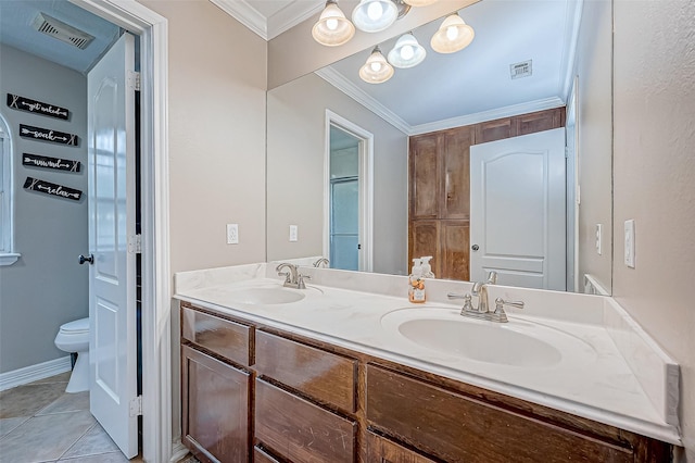 bathroom featuring ornamental molding, vanity, tile patterned floors, and toilet