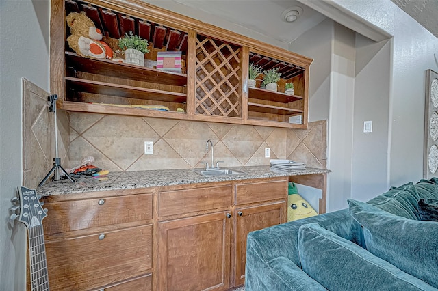 kitchen featuring sink and backsplash