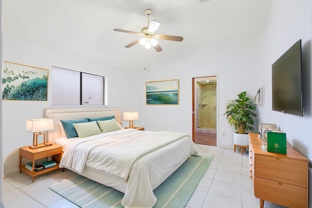 tiled bedroom featuring ceiling fan and ensuite bath