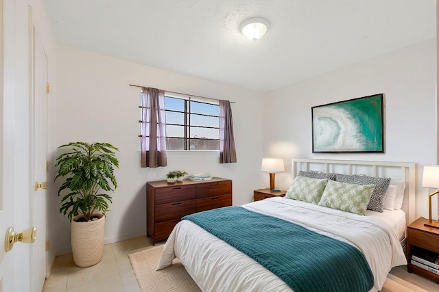 bedroom with light tile patterned flooring