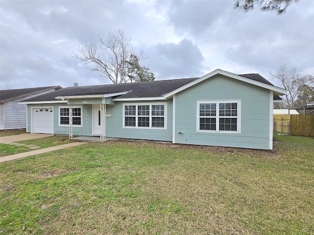 ranch-style house featuring a garage and a front yard