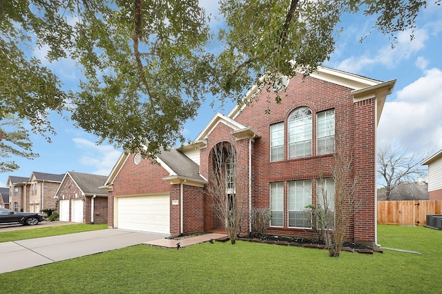 traditional home with a garage, brick siding, driveway, and a front lawn