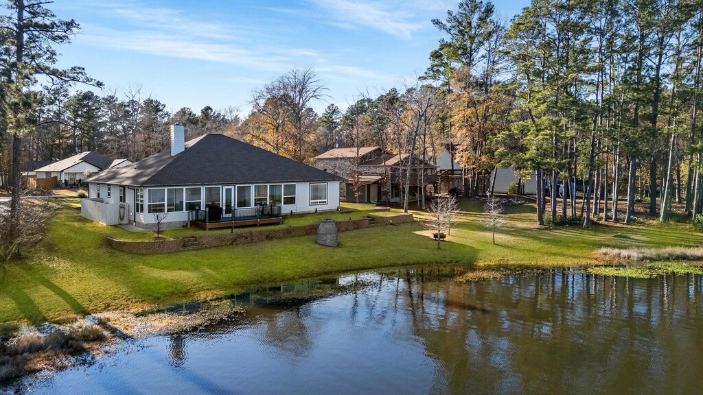 105 Greenway Dr, Trinity, TX 75862 - back of property featuring a water view and a yard