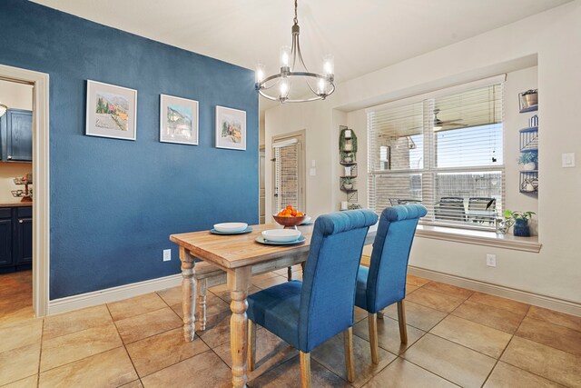 dining area with a chandelier and light tile patterned floors