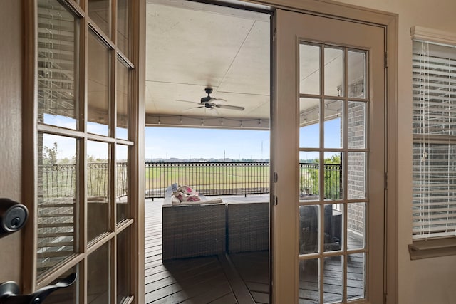 entryway featuring french doors and ceiling fan